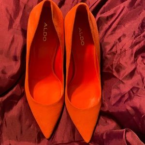 Very elegant orange Aldo stiletto shoes.